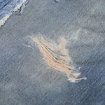 Vintage Washed Distressed Denim Bermuda Shorts with Frayed Panels