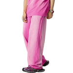Pantalones deportivos holgados con bordes sin rematar y lavados